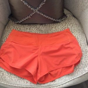 LULULEMON ORANGE SHORTS SIZE 4